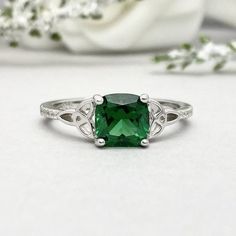 This beautiful ring is made from genuine 925 sterling silver with rhodium plating.Ring details--The Main stone is a Cushion Cut 7MM Lab Created Nano Emerald Stone -Side stones are 1mm Round simulated diamonds -Ring is casted in solid 925 sterling silver with rhodium plating (yellow gold and rose gold plated also available, please check the drop down menu for more options)-The Total face height of the ring measures 7.5mms and the band width measures 2mms-Each ring is handmade and made to order, s Wedding Emerald Ring In 14k White Gold, Classic White Gold Diamond Ring For May Birthstone, Silver Princess Cut Emerald Ring For Wedding, Classic Green Jewelry For Promise Occasions, Sterling Silver Open Ring With May Birthstone, Silver Princess Cut Gemstone Birthstone Ring, Sterling Silver Open Ring For May Birthstone, Silver Princess Cut Birthstone Ring With Gemstone, Sterling Silver Promise Ring With Princess Cut Crystal