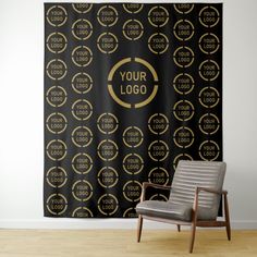 a chair sitting in front of a black and gold wallpaper with the words your logo on it