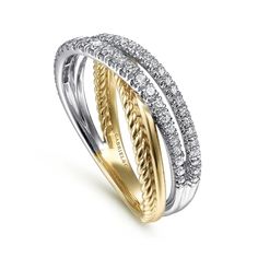 two tone gold and white gold ring with diamonds on the sides, set against a plain background