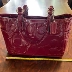 Coach Patent Leather Embossed With Logo C, Deep Red Measuring 12x9x4.5 Inches. New Without Tag, Never Used In Its Original Dust Bag Red Coach Bag, Logo C, Patent Leather Bag, Red Purse, Coach Logo, Bag Dark, Red Purses, Deep Red, Embossed Leather