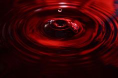 a red water droplet is seen in this image