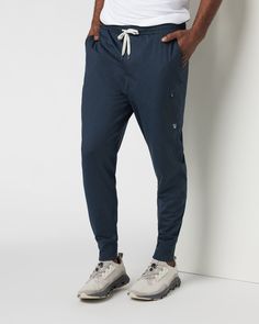 A fresh take on athleisure and a staple in your wardrobe, the Sunday Performance Joggers are premier in fit, function and soft stretch. This jogger style will keep you moving with less bulk around your ankles. | Vuori Sunday Performance Jogger Pants | Ink Heather | Medium Vuori makes premium performance apparel inspired by the active Coastal California lifestyle; an integration of fitness, surf, sport, and art. Breaking down the boundaries of traditional activewear, we are a new perspective on p Mens Athleisure, Athleisure Men, Coastal California, Blue Joggers, California Lifestyle, Fashion Joggers, Performance Outfit, S Models, Jogger Pants