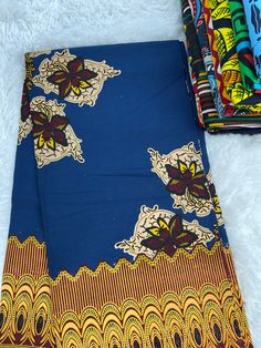 This blue and gold African Fabric is high quality African print made from 100% cotton and it's 45 inches wide. It is used for making African Clothing, African quilts, & For Home decoration. FYI: Print is Double sided. The listing is for 1, 6 yards and Headwrap Each piece of fabric measures:  36in by 45in for 1 yard 216in by 45in for 6 yards 70in by 22in for Head wrap If you purchase more than one yard, you will receive one continuous piece. *If you require more than what I have listed, feel free to send me email. CARE INSTRUCTIONS: *DO NOT BLEACH *Hand wash with cold water and mild soap or Dry clean *Press with hot iron for a crispy look. Color may be different due to your monitor Traditional Blue Block Print Fabric, Blue Ankara Fabric With Traditional Patterns, Blue Cotton Fabric With Traditional Patterns, Traditional Blue Batik Print Fabric, Blue Printed Ankara Fabric, African Quilts, Clean And Press, Shoe Making, African Prints