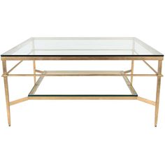 a glass and brass coffee table with two shelves on each side, against a white background