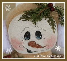 a close up of a stuffed animal with snowflakes on it's head