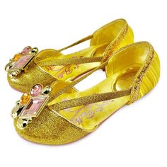 Your princess-to-be will step lively into a world of pure fantasy wearing these shimmering v-strap shoes. With their golden sequin trims and faceted gem adornments, they are made to match perfectly with our Belle costume collection. Authentic Disney Princess costume shoes inspired by Disney's Beauty and the Beast (1991). Genuine, Original, Authentic Disney Store Product. Disney Ariel Costume, Belle Dress Up, Princess Belle Costume, Bell Shoes, Gold Slippers, Disney Princess Costumes, Dress Up Shoes, Belle Costume, New Disney Princesses