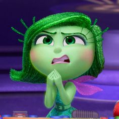 a cartoon character with green hair is making a surprised face while holding her hands together