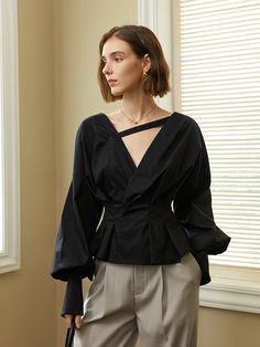 Editor's Notes The blouse has puffed sleeves with buttons at the sleeve ends, addressing an elegant mood. Pair with Knot Belted Tailored Trousers for a chic, stylish fit. - Wrap blouse with a deep V-neckline- Strip of fabric connecting the necklines- Low cut backline- Buttons at the backMeasurements(in.)ONE SIZE - Chest: 34.64 in.- Waist: 27.16 in. - Shoulders: 10.62 in. - Total Length: 21.06 in.Model info: Height 5' 7.5, Size 55Composition & Care- 100% Polyester- Dry clean or light handwashing recommendedDesigner- by yyiam Formal Tops With Blouson Bishop Sleeves, Evening Tops With Pleated Lantern Sleeves, Office Tops With Bishop And Gathered Sleeves, Office Tops With Gathered Bishop Sleeves, Evening Tops With Bishop Sleeves, Evening Tops With Blouson Bishop Sleeves, Evening Long Sleeve Top With Gathered Sleeves, Formal Puff Sleeve Tops For Fall, Elegant Puff Sleeve Top With Gathered Sleeves For Office