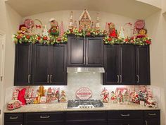 a kitchen decorated for christmas with gingerbreads and candy canes