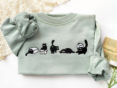 This sweatshirt is made of high quality cotton weave, advanced embroidery technology to ensure bright colors and detailed patterns, unisex and soft and comfortable. Sweatshirt makes for an edgy, casual style. Each sweatshirt has a unique aesthetic, and is a gift that will not go out of style for your own family, friends, or teachers. Size We offer a variety of colors and different sizes, you can choose your favorite and size, we recommend that you use the size of the potential better fit or loose size, if you like a tight fit can be selected according to the size, if you have any special requirements, please give me a message! Maintenance Wash from inside to outside with cold water and dry with a low-speed tumble dryer. Please do not dry clean. Do not rub the embroidery pattern with force. Cotton Crew Neck Sweater With Cat Design, Casual White Sweatshirt With Cat Design, Embroidered Cat Sweatshirt, Cotton Crew Neck Sweatshirt With Cat Design, Black Cotton Sweatshirt With Cat Design, Cat Design Cotton Long Sleeve Sweatshirt, Casual Crew Neck T-shirt With Cat Design, Embroidered Cat, Playful Crew Neck T-shirt With Cat Design