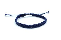 a blue string bracelet on a white background