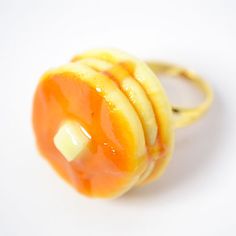 an orange ring with two pieces of fruit on it