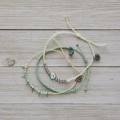 This Set From Pura Vida Comes With Three Bracelets; A White String Bracelet With Silver Beads And Turquoise + Silver Ocean Wave Charm, A Mint Mini Braided Bracelet, And A Cream String Bracelet With Sea Glass Beads And Silver Spike Details. Nwot: The Item Is In Perfect Condition - 100% Waterproof - Wax Coated - Adjustable From 2-5 Inches In Diameter Please Reach Out With Any Questions On This Item! . Bundle + Save! Enjoy 15% Off When You Purchase Two Or More Items From My Closet Bohemian | Festival | Concert | Spring Break | Summer | Beach | Vacation | Sun | Surf | Swim | Water | Summertime | Athleisure | Yoga Summertime Athleisure, Sea Glass Beads, Bracelet Pack, Pura Vida Bracelets, Festival Concert, Bohemian Festival, Braided Bracelet, Bracelet Ideas, Ocean Wave