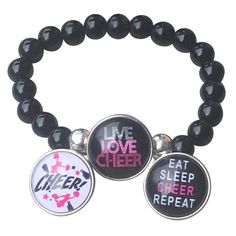 CHEER JEWELRY - Interchangeable Cheerleading charm bracelet CHEERLEADER SNAP BRACELET - Includes 2 Cheerleading Snap Charms. Snap Jewelry is a unique style of interchangeable jewelry that features "snap button charms" that you snap in and out of our stylish bracelet ADJUSTABLE -Black Beaded Bracelets are elastic and will stretch to fit most wrists. CHEER GIFT- Looking for an inexpensive cheer gift to show your team spirit? Got a birthday, holiday, or other special occasion coming up for the cheerleader in your life? This pretty yet inexpensive sports bracelet makes a great gift, whether for a friend, daughter, cheer mom, or teammate. DESIGNED & SOLD BY Infinity Collection- A USA family owned business. Our mission is to help athletes show team spirit with sports accessories. We pride oursel Cheer Gifts Bracelets, Pandora Cheer Bracelets, Cheer Jewelry, Softball Jewelry, Button Charms, Charm Bracelets For Girls, Gymnastics Gifts, Cheer Gifts, Interchangeable Jewelry