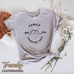 "Family Camping Trip Shirt,Camp Life Tshirt,2024 Vacation Gift,Camper Tee,Family Travel Shirt,Family Camping Gift,Nature Lover Family Shirt ----- How To Order ----- 1-) Please, check and review all the photos. 2-) Choose your t-shirt size and color. *Different styles of shirts may have different shades of same color choice due to different manufacturer brands. *For this reason, we recommend you to match shirts from the same styles if you want precisely matching colors (ex. Unisex, V-necks, Toddler, etc.). 3-) Click add to cart. You can go back to add more shirts. 4-)Click \"Proceed to check out\". 5-)When you check out, you can add a note to seller for any request. ----- Unisex Shirts ----- * Unisex t shirt fits like a well-loved favorite, featuring a crew neck, short sleeves and designed Custom Print Short Sleeve T-shirt For Family Outings, Family Matching Tops With Custom Print For Family Gatherings, Graphic Print Crew Neck T-shirt For Family Outings, Family Matching Graphic Print T-shirt For Gatherings, Family Matching Graphic T-shirt, Family Matching Crew Neck Shirts For Gatherings, Family Matching Crew Neck Shirt For Family Gatherings, Family Matching Cotton T-shirt For Camping, Casual T-shirt With Custom Print For Family Outings