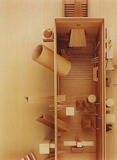 an overhead view of a wooden room with shelves and other items on the floor in it