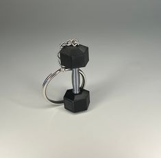 a black object is sitting on top of a keychain