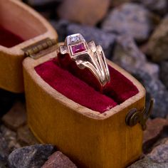 This vintage ring features a square step cut lab created ruby and a single cut diamond set in white gold. The shoulders of the ring are accented with fluted shoulders. This ring is crafted in 14k yellow gold with a rich patina, and it is currently a siz Vintage Rectangular Ruby Ring For Formal Occasions, Formal Vintage Rectangular Ruby Ring, Vintage Ruby Diamond Ring Stamped 14k, Vintage Ruby Diamond Ring In 14k Gold, Vintage Rectangular Ruby Jewelry, Vintage Diamond Ruby Ring For Collectors, Vintage Ruby Ring With Diamond Cut, Vintage 14k Gold Red Diamond Ring, Vintage Ruby Ring With Diamond For Collectors