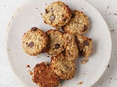 a white plate topped with cookies and oatmeal on top of a table