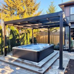 an outdoor hot tub in the middle of a yard