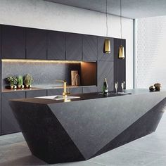 a modern kitchen with black and gold accents