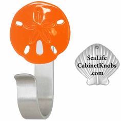 an image of a blue sand dollar on a metal hook with the sealife cabinet knobs com logo below it