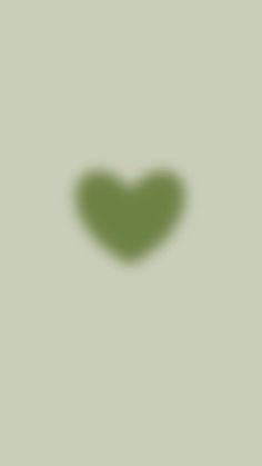 the shadow of a heart on a green background