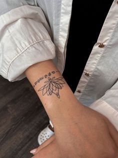 a woman's arm with a tattoo on it