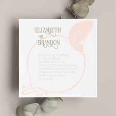 a wedding card with the words elizabeth and brandon written on it next to some flowers