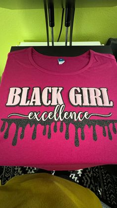 You are a personification of excellence! We are not moving with magic this season but in excellence. This t-shirt isn't the traditional plain vinyl! Black Girl is puff vinyl and trimmed with glitter vinyl. Oh, don't forget we drip with glitter too! Oh, to be black and move in excellence! This isn't your usual t-shirt...drip with glitter and puff this season. Black Short Sleeve T-shirt With Glitter Print, Black T-shirt With Glitter Print And Short Sleeves, Black Cotton T-shirt With Glitter Print, Black Glitter Print Graphic Tee, Black Graphic Tee With Glitter Print, Trendy Black T-shirt With Glitter Print, Black Crew Neck T-shirt With Glitter Print, Puff Vinyl, Glitter Vinyl