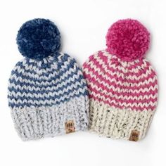 two knitted hats with pom - poms are shown on a white background