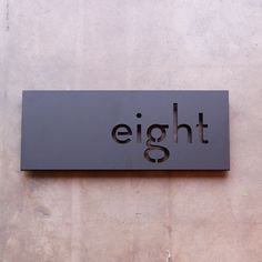 a black sign that says eightt on it