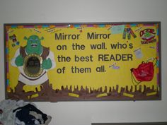 a bulletin board with an image of a mirror on the wall who's the best reader of them all