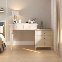 a bedroom with a bed, desk and lamp on it's side in front of a window