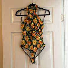 Nwt Zara Bodysuit. Beautiful Floral Design With A Halter Neck. Snap Closure. Has Some Stretch. Material Feels Almost Like A Swimsuit. Size Small. Please Ask Any Questions! Zara Bodysuit, Neck Snap, Halter Bodysuit, Zara Tops, Halter Neck, Green Yellow, Snap Closure, Floral Design, Zara