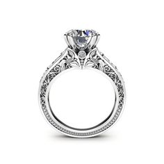 a white gold engagement ring with an intricate design on the shan shan shan shan shan shan shan