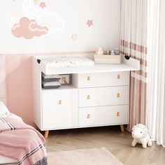 a child's bedroom with pink and white decor