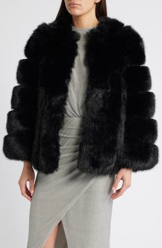 Finish a formal look or elevate an everyday one with a plush faux fur jacket that keeps you cozy yet chic. 28" length (size Medium) Front hook-and-eye closure Collarless Lined 100% polyester faux fur Dry clean Imported Elegant Faux Fur Outerwear, Elegant Outerwear With Faux Fur, Formal Mink Outerwear With Faux Fur Lining, Formal Faux Fur Outerwear In Mink Color, Elegant Faux Fur Outerwear For Fall, Elegant Fluffy Winter Outerwear, Elegant Faux Fur Coat For Fall, Formal Faux Fur Coat For Fall, Luxury Outerwear With Faux Fur Trim