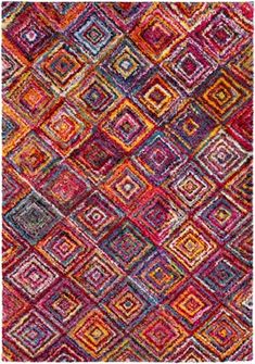 a multicolored area rug with squares and rectangles