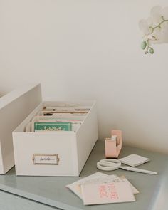 a desk with a drawer, file folders and other office supplies