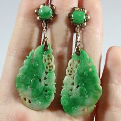 -Antique Chinese 14k Gold Carved Natural Green Jadeite Screw Back Earring -Total length: 1.75 in -Carved jadeite size: 31.5 mm x 18.65 mm x 1.75 mm -Jadeite bead size: 6.55 mm -Total weight: 6.4 g  -Marked 14k Vintage Green Jade Earrings, Antique Green Clip-on Jewelry, Traditional Green Jade Earrings, Green Jade Earrings For Wedding, Jadeite Jewelry, Tibetan Earrings, Tibetan Jewelry, Jade Earrings, Screw Back Earrings