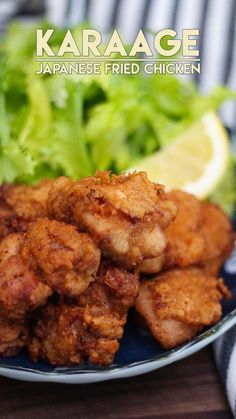 a close up of a plate of food with lettuce and chicken on it