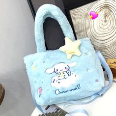 Sanrio Cinnamonroll Crossbody Handbag Blue Plush Zip Top Closure Detachable Strap This Cute Plush Crossbody Handbag With Detachable Strap, Kawaii Handbag With Zip Top Closure Made Of High-Quality Washed Plush Fabric , Soft , And Durable. Made To Last. Lightweight Fashionable Y2k From A Smoke-Free Environment Kawaii Light Blue School Bag, Trendy Blue Bags For Winter, Trendy Blue Shoulder Bag For Winter, Casual Blue Shoulder Bag With Double Handle, Trendy Blue Winter Bags, Cute Blue Bag With Zipper Closure, Blue Kawaii School Bag, Kawaii Style Blue School Bag, Blue Handheld Bag With Zipper Closure