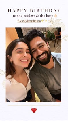 a man and woman are smiling for the camera with a happy birthday card in front of them