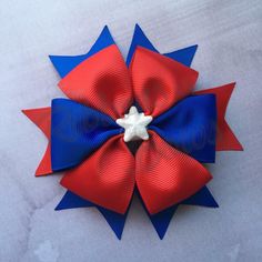 a red, white and blue bow with a star on it