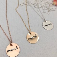 A minimalist lover's modern token of motherhood. A beautiful piece to celebrate your mama status. Mamã with the accent on the a is an ode to the designers Portuguese heritage. We love this piece to layer with other necklaces. Pendant measures 5/8 inch. Available in sterling silver, 14kt gold or rose gold fill made to last and be worn everyday. Fancy Font. This piece is ready to ship and usually leaves our studio in 1 to 3 business days. BACK TO MY SHOP: https://www.etsy.com/shop/IsabelleGraceJew Nickel-free Name Necklace For Mother's Day Gift, Nickel-free Necklace For Mother's Day Personalized Gift, Hand Stamped Name Necklace For Mother's Day, Personalized Rose Gold Necklaces For Mother's Day, Personalized Rose Gold Necklace For Mother's Day, Everyday Mother's Day Charm Necklace With Round Disc, Everyday Round Disc Charm Necklace For Mother's Day, Mother's Day Pendant Charm Necklace, Nickel Free Necklaces For Mother's Day