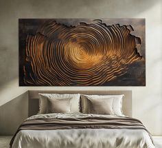 a large metal art piece on the wall above a bed