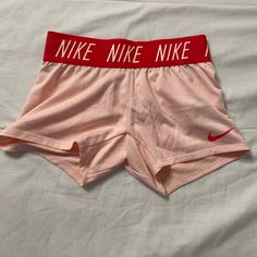 Pink Nike Shorts Extra Small Excellent Condition, Never Worn A Little See Thru Summer Loungewear Bottoms With Logo Waistband, Fitted Summer Bottoms With Logo Waistband, Fitted Bottoms With Logo Waistband For Summer, Sporty Bottoms With Logo Waistband For Spring, Casual Shorts With Logo Waistband, Pink Cotton Gym Bottoms, Summer Stretch Bottoms With Logo Waistband, Summer Athleisure Bottoms With Logo Waistband, Casual Stretch Bottoms With Logo Waistband