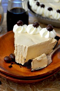 a piece of pie on a plate with chocolate chips and whipped cream toppings next to it