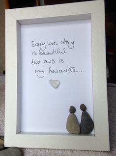 two rocks in a white frame with the words, every love story is beautiful but ours is my favorite